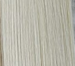 Set of hair extensions in various colors on a textured surface